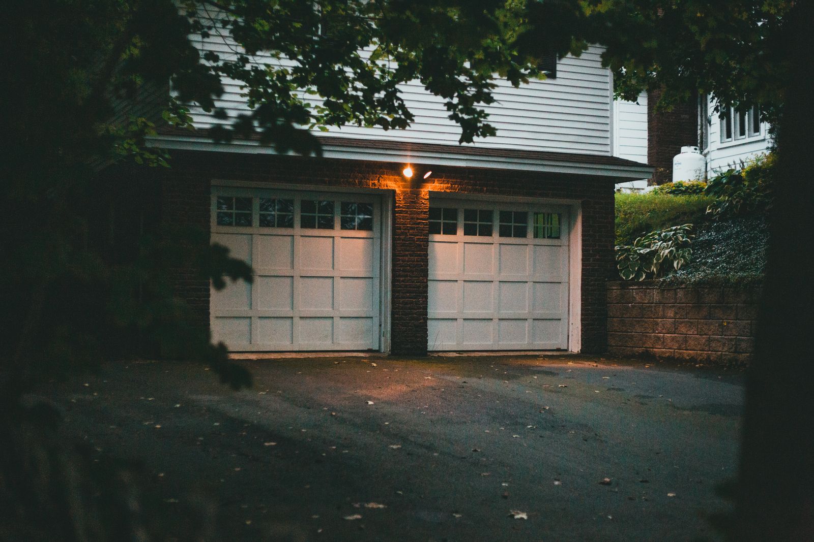 Two-car garage door at dusk on a Salt Lake City home